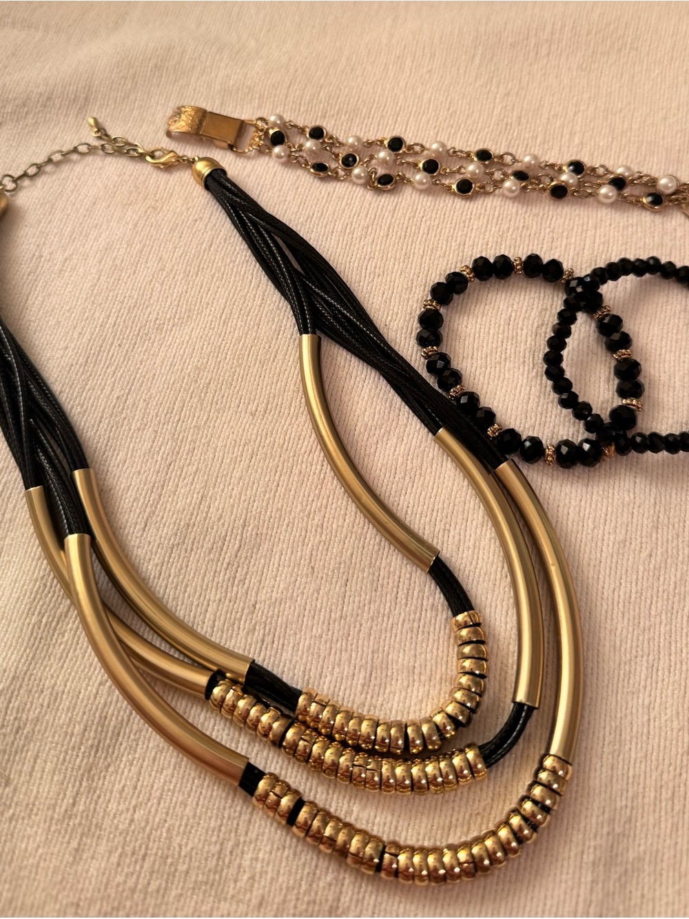 Gorgeous black and gold jewelry lot of 1 necklace and 3 bracelets